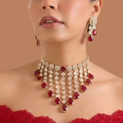 Gold finish ruby red kundan choker necklace set with cascading polki-style strands, ruby pear drops and matching drop earrings – Auraa Trends