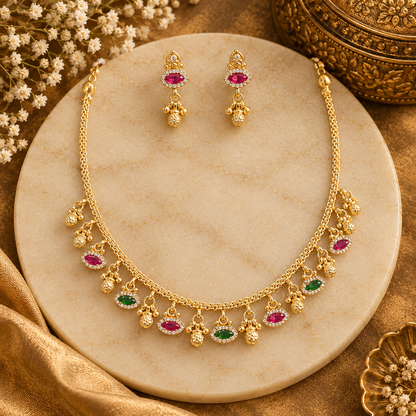 Antique gold finish necklace set with ruby pink and green marquise stone charms and gold bead drops