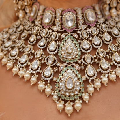 "Antique gold kundan meenakari bridal choker necklace set with pink and mint enamel work and pearl drops, paired with matching jhumka earrings"