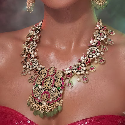 Pink and green temple Kundan necklace set with goddess pendant and matching earrings