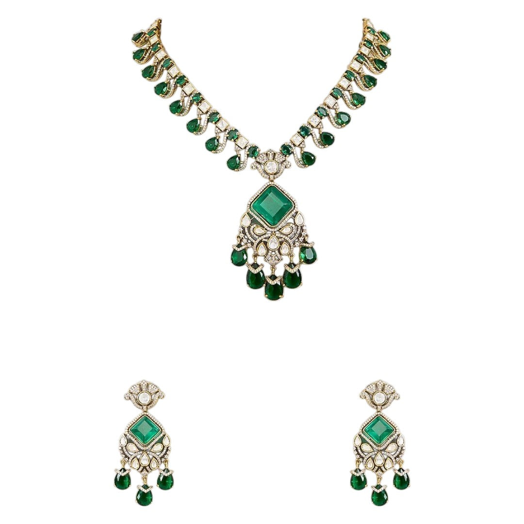 "Antique gold Kundan necklace with square-cut emerald pendant and teardrop drops, matching drop earrings"
