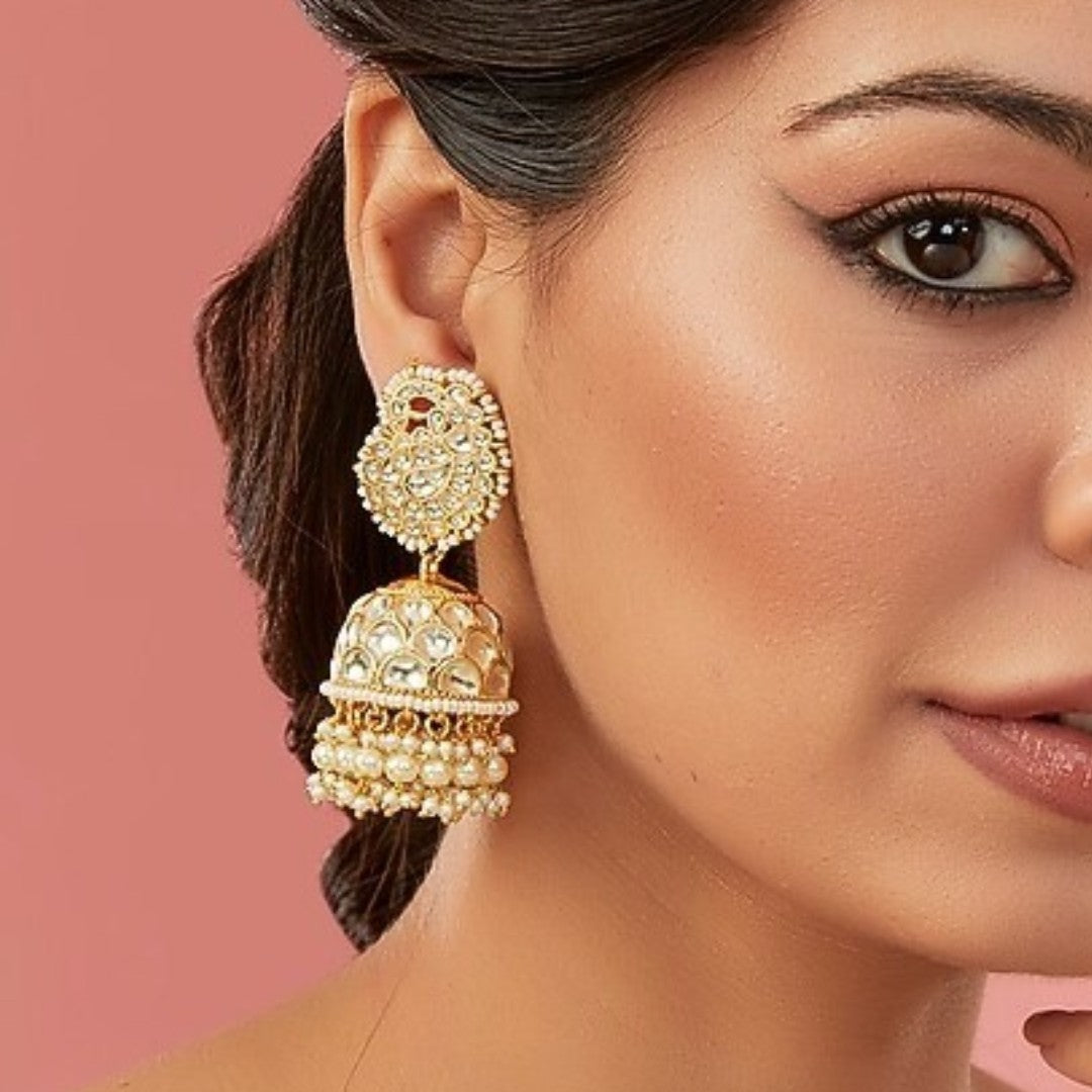 Gold kundan chandbali earrings with pearl beadwork and jhumka-style drops