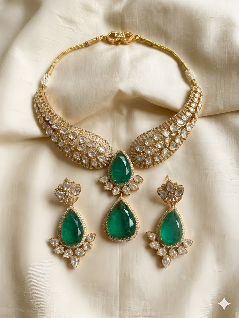 Gold Kundan necklace set with green teardrop pendant and matching earrings