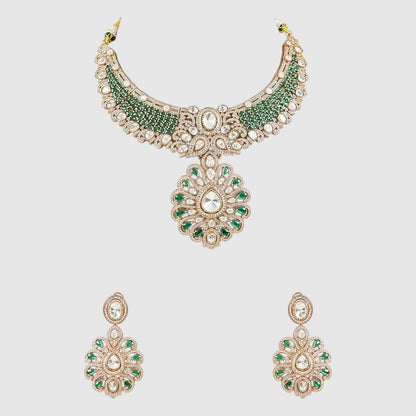"Green Kundan and Polki bridal necklace set with floral pendant and matching earrings on a gold-toned base."