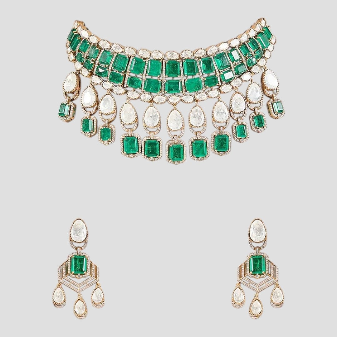 “Traditional choker necklace set featuring emerald-green square stones, Polki-style pear-shaped drops, and matching dangling earrings displayed on a neutral background.”