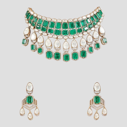 “Traditional choker necklace set featuring emerald-green square stones, Polki-style pear-shaped drops, and matching dangling earrings displayed on a neutral background.”
