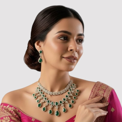 “Gold-plated necklace set with red ruby teardrop stones and matching earrings for women.”