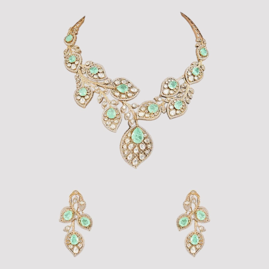Mint green and white stone leaf-design necklace set with matching earrings.