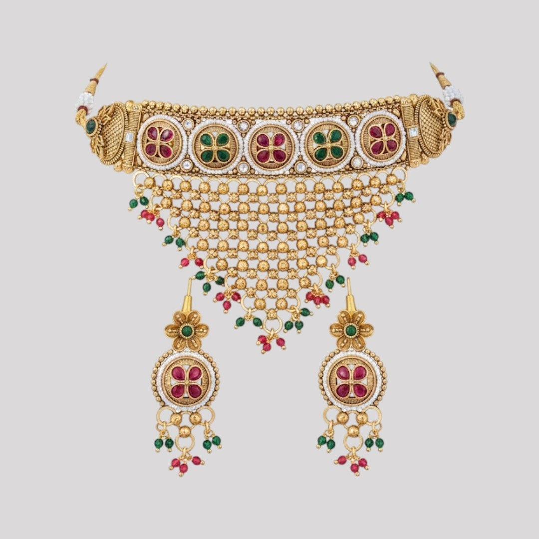 “Gold-plated temple choker necklace set with floral motifs, multicolour stones, mesh design, and matching earrings.”