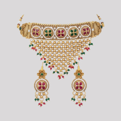 “Gold-plated temple choker necklace set with floral motifs, multicolour stones, mesh design, and matching earrings.”
