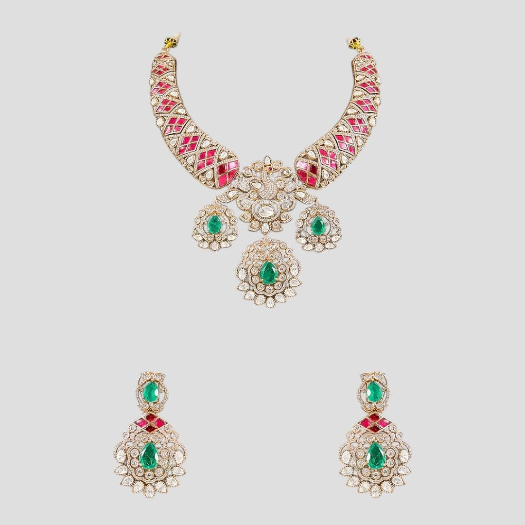 "Traditional Kundan bridal jewelry set with a gold-toned necklace featuring ruby and emerald stones, paired with matching earrings."