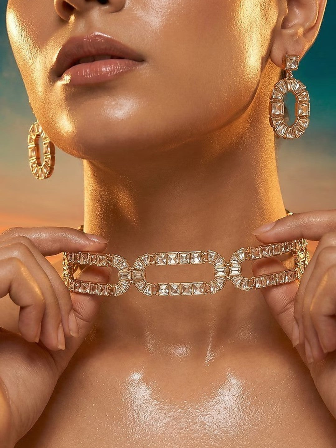 Gold-plated geometric crystal statement necklace set with matching oval drop earrings featuring baguette-cut stones for women.