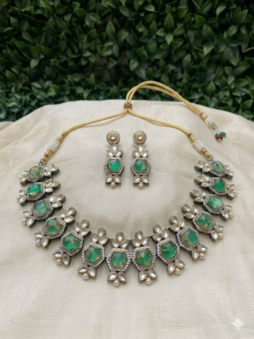 Premium Kundan craftsmanship with floral detailing Elegant green stone centerpiece design