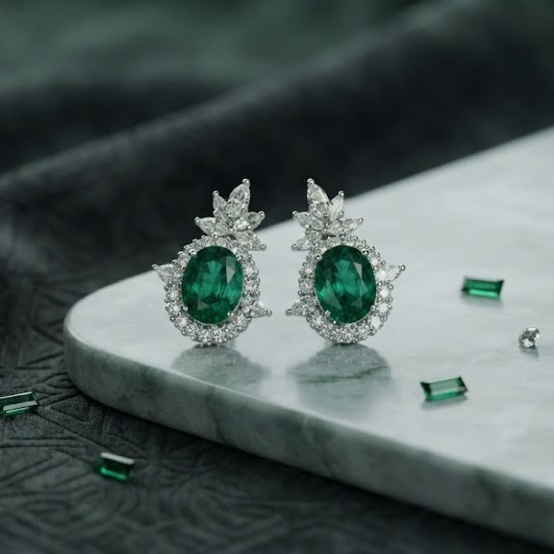 Rhodium plated emerald green oval stud earrings with marquise CZ floral crown halo design