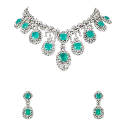 "Silver rhodium-plated multi-tier bridal necklace set with white American diamonds and cushion-cut emerald green stones, paired with matching drop earrings"