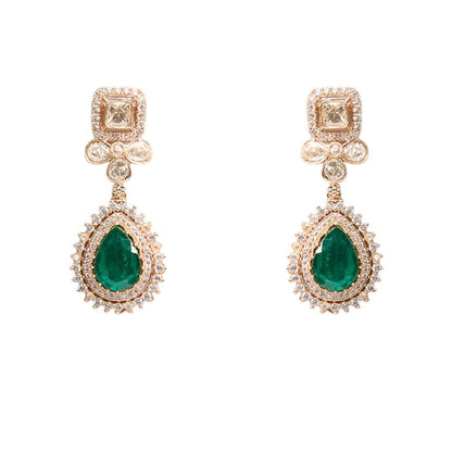Beautiful Emerald Drop Kundan Earrings – Gold Plated Statement Jewelry - Auraa Trends - Earrings -  - Auraa Trends - A pair of gold - finished Kundan earrings with emerald green teardrop stones and floral detailing, placed on a white background