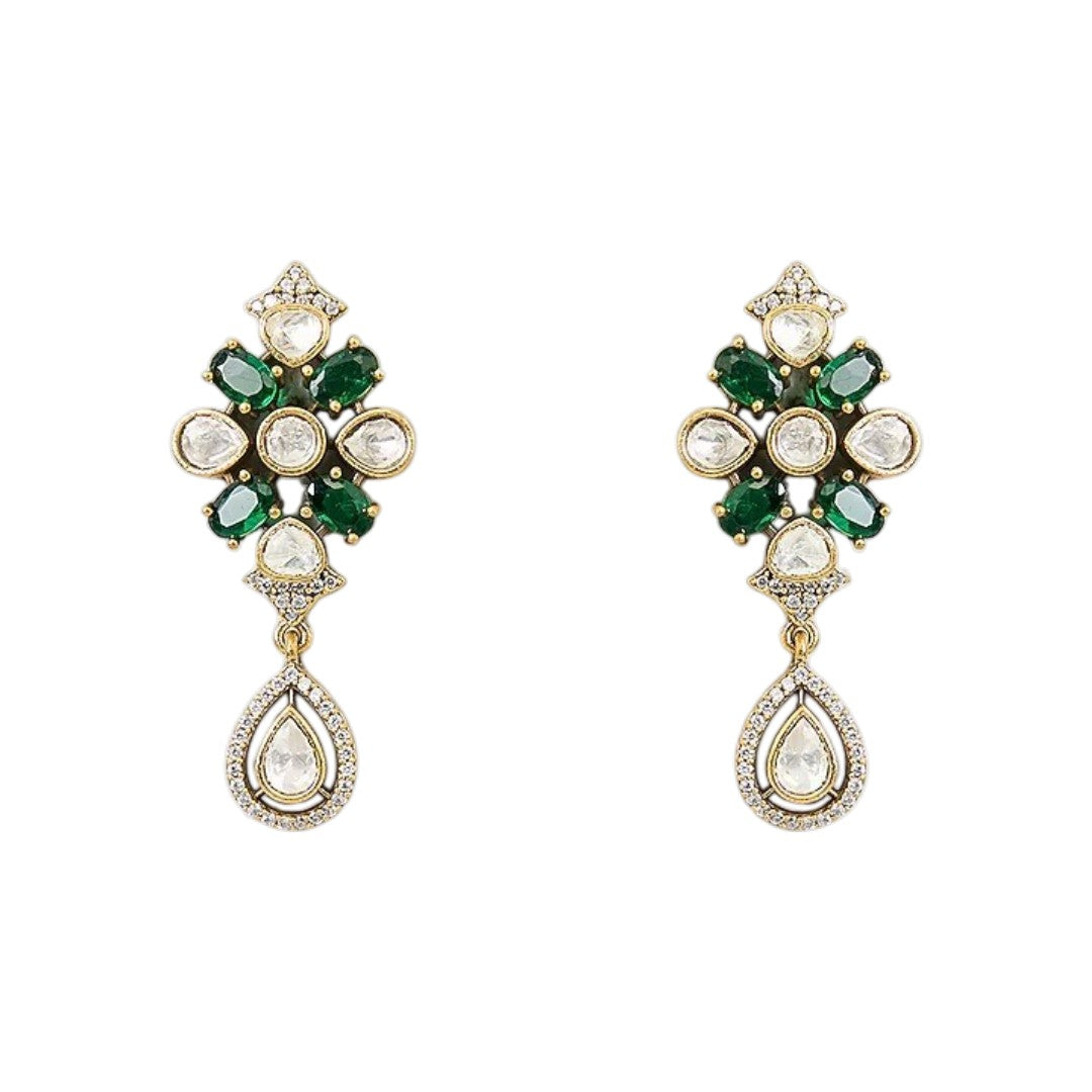 "Emerald green Kundan-style necklace and earring set with antique gold finish and white stone accents"