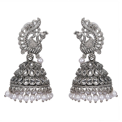 Buy Aviana Silver - Plated Crystal Studded Traditional Jhumka Earrings for Women - Auraa Trends - Jhumka -  - Auraa Trends - Lady wearing silver - plated crystal peacock pattern jhumka earrings with pearl drops, Indian ethnic traditional jewellery