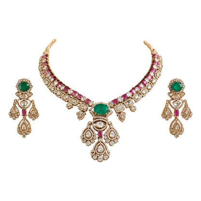 Gold-plated Kundan necklace set with green emerald-look center stone, pink ruby accents and matching American diamond earrings for bridal and wedding wear.