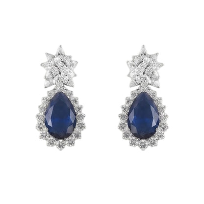 "Silver rhodium-plated V-shaped necklace set with white American diamonds and blue sapphire pear-drop stones, paired with matching teardrop earrings"