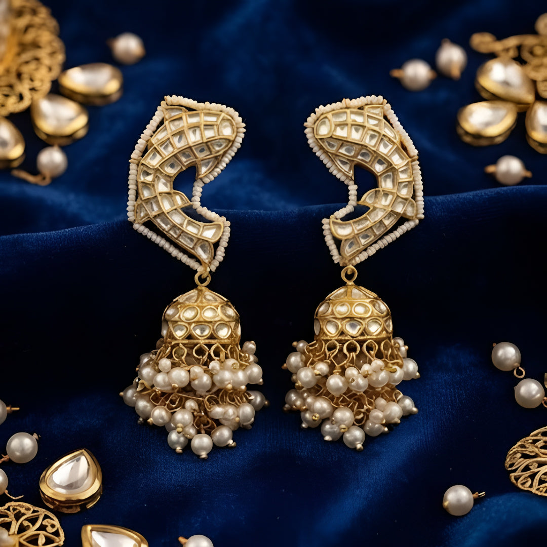 Gold-plated Kundan Jhumka earrings with pearl drops for women, traditional ethnic wedding and festive jewellery.