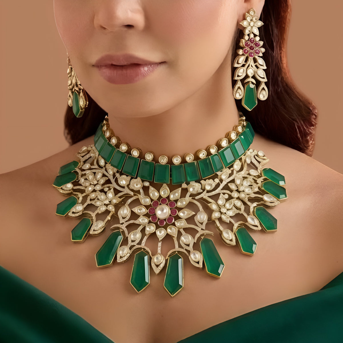 Gold plated emerald green kundan bridal choker necklace set with ruby-pink flower centre, green drops and matching chandelier earrings
