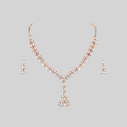Elegant leaf design American diamond necklace with green stone detailing and matching earrings on red velvet display stand