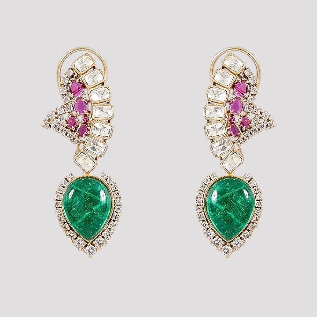 "Gold-plated designer necklace set with ruby stones, white crystals, and emerald teardrop centerpiece, paired with matching earrings"