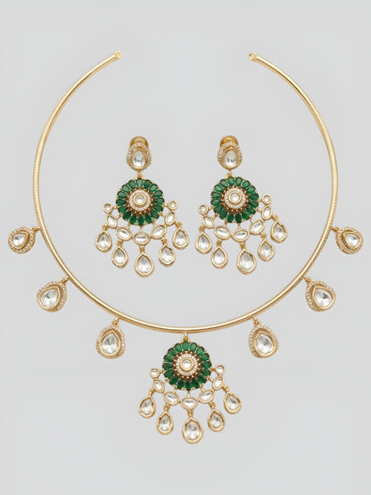 Gold plated choker necklace set with green stones and kundan detailing, featuring matching earrings and teardrop hanging design
