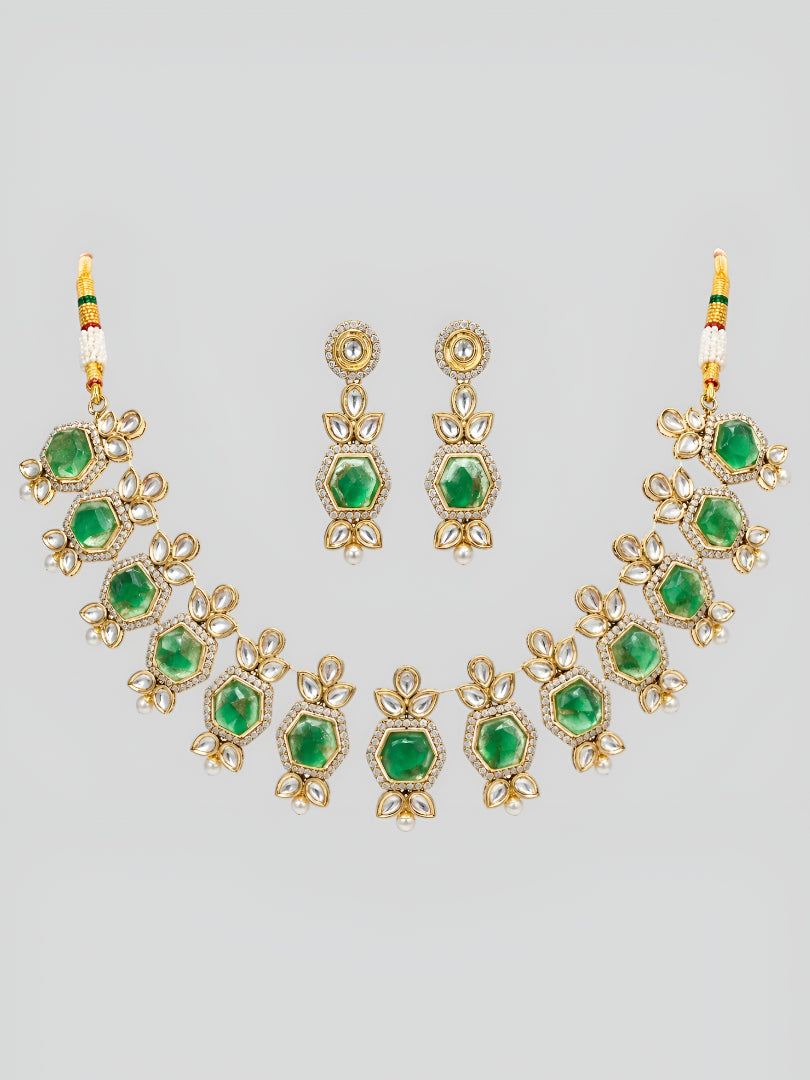 Premium Kundan craftsmanship with floral detailing Elegant green stone centerpiece design