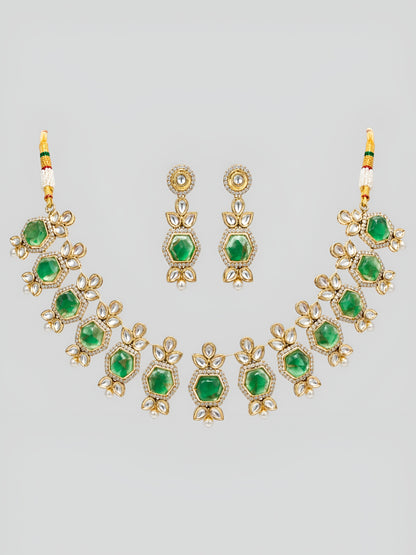 Premium Kundan craftsmanship with floral detailing Elegant green stone centerpiece design