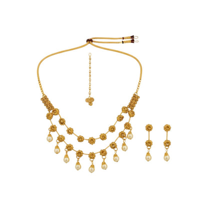 Traditional gold-plated necklace set with floral motifs and matching earrings displayed on red stand