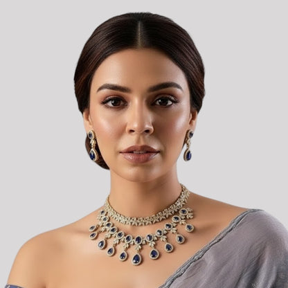 “Gold-plated necklace set with red ruby teardrop stones and matching earrings for women.”