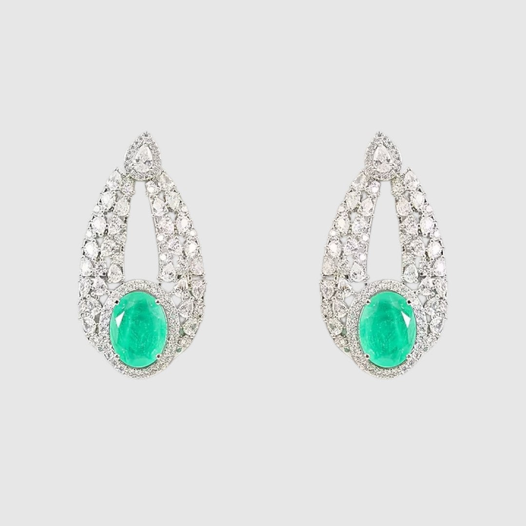 “Silver-plated choker necklace with large emerald green stone and matching earrings”