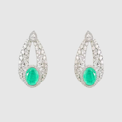 “Silver-plated choker necklace with large emerald green stone and matching earrings”