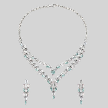 Elegant American Diamond necklace set displayed on a red velvet stand, featuring a double-layered V-shaped necklace with matching earrings, perfect for bridal or party wear.