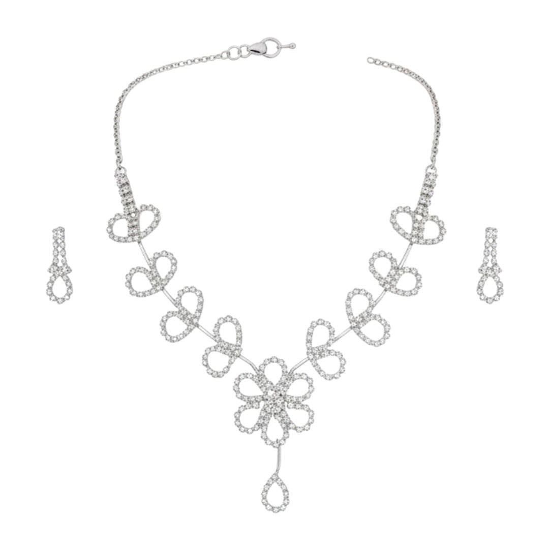 Floral diamond-look necklace set with matching earrings on red display stand