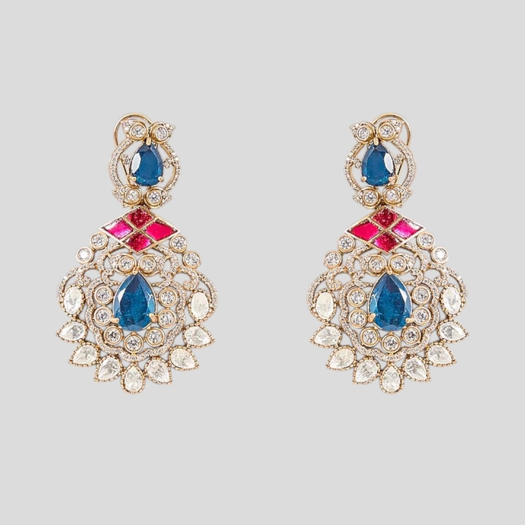 "Gold-plated kundan necklace set with pink inlay, blue teardrop stones, green emerald drops, and matching earrings"