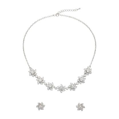 Sparkling floral American diamond necklace with matching earrings displayed on red velvet stand