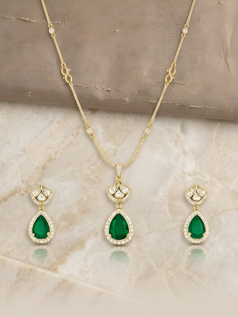 Gold-plated necklace set featuring emerald green teardrop pendant and matching drop earrings embellished with American diamonds.
