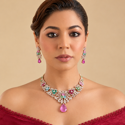 Rose gold plated American diamond necklace set with multicolour pastel flower stones, pink teardrop pendant and matching earrings