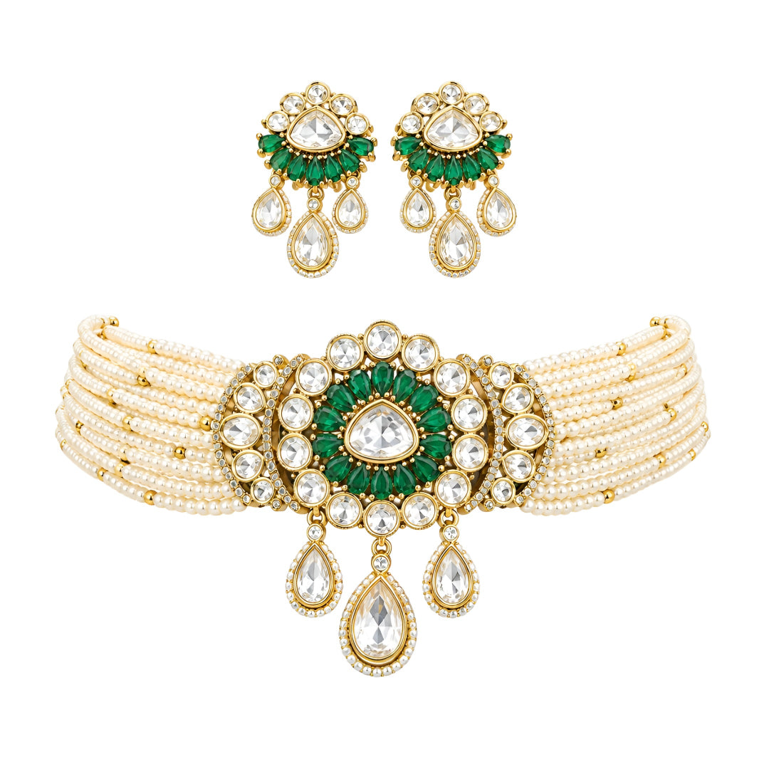 Green kundan pearl choker necklace set with floral centre pendant, kundan teardrop drops and matching floral earrings on a grey display bust