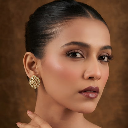 Pair of gold finish kundan polki stud earrings with clear centre stone and zircon halo