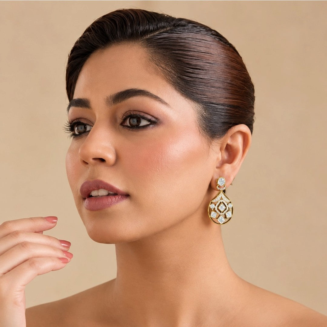 Gold-plated kundan style drop earrings with round halo stud, pavé fan bridge and open teardrop body set with square and round clear zircon stones