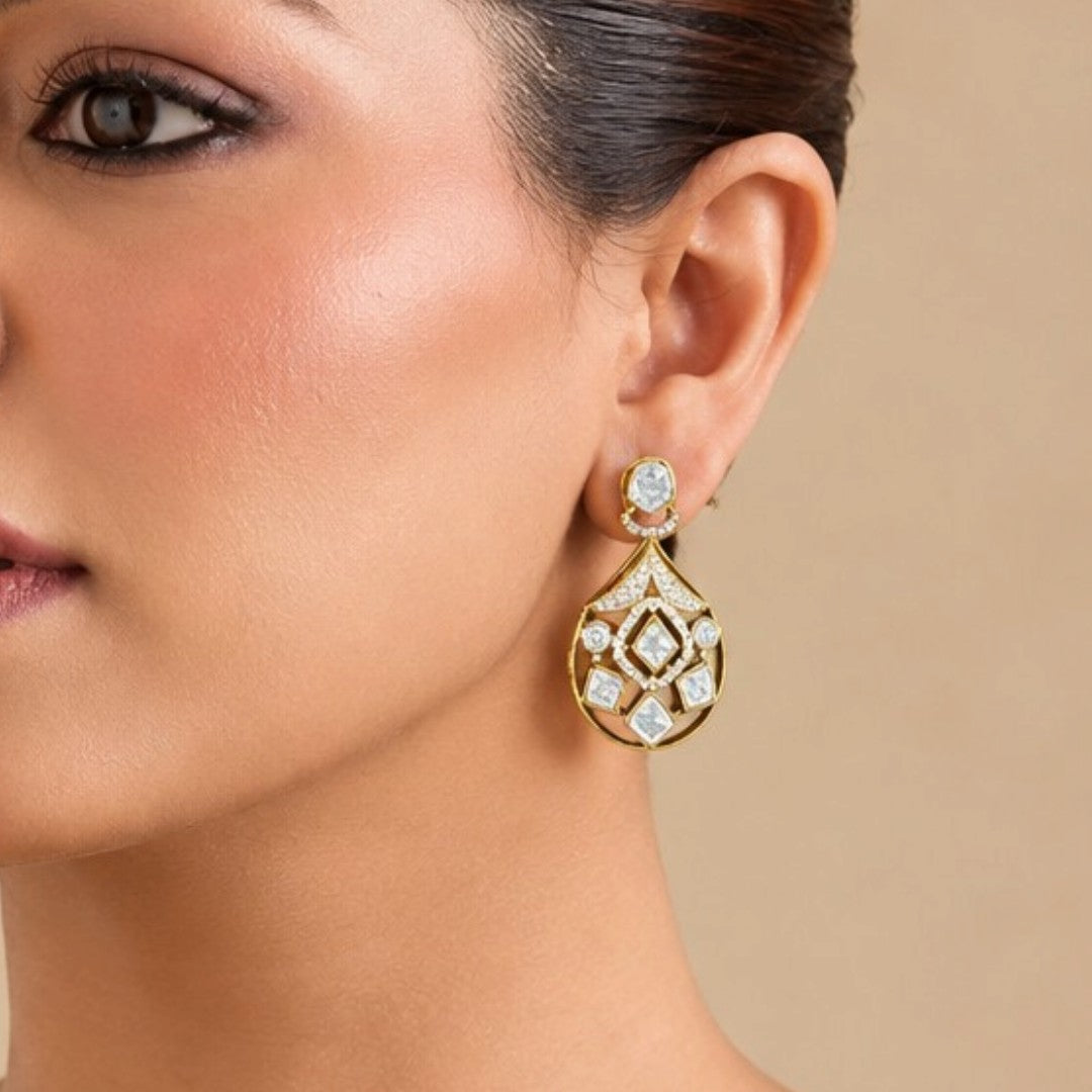 Gold-plated kundan style drop earrings with round halo stud, pavé fan bridge and open teardrop body set with square and round clear zircon stones