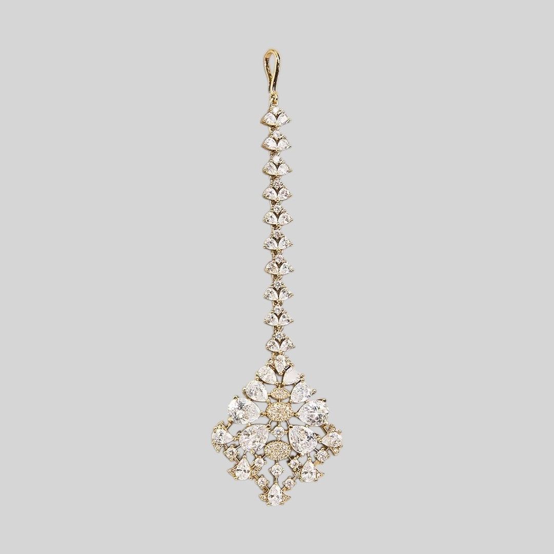 Gold finish American diamond maang tikka with clear pear-cut zircon stones, pave zircon accents and a leaf-shaped zircon chain – Auraa Trends
