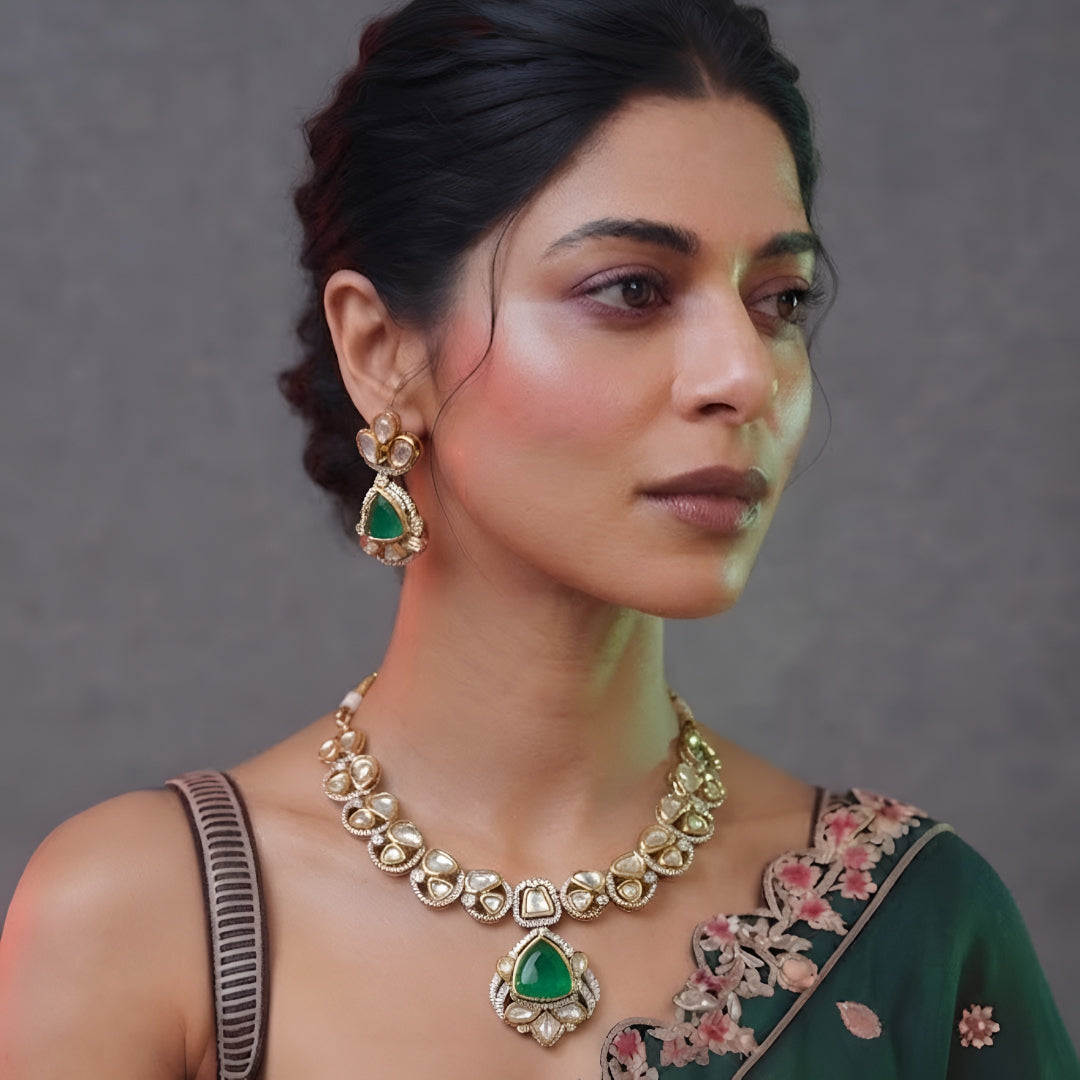 Green kundan pendant necklace set with emerald triangular stone, kundan petals and matching drop earrings