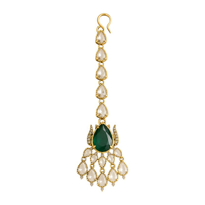 Gold maang tikka with pear-cut emerald green stone and clear kundan crystal chain, Indian bridal hair jewelry on white background