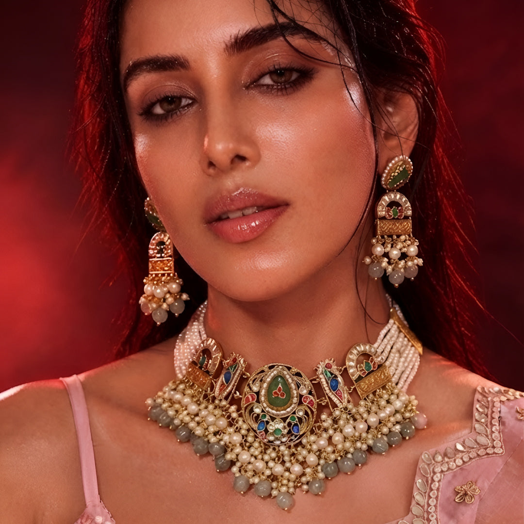"Antique gold multi-strand pearl beaded necklace and earring set with meenakari enamel work and grey bead drops, temple jewellery on maroon backdrop"