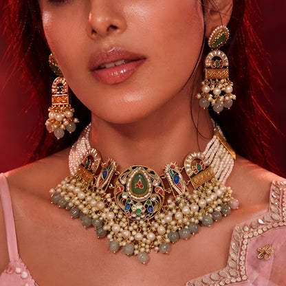 "Antique gold multi-strand pearl beaded necklace and earring set with meenakari enamel work and grey bead drops, temple jewellery on maroon backdrop"